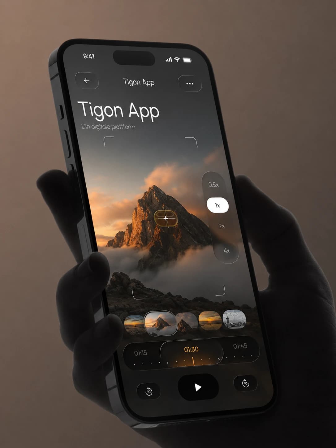 Telefon med Tigon App og en fjelltopp i solnedgang i et mørkt videogrensesnitt