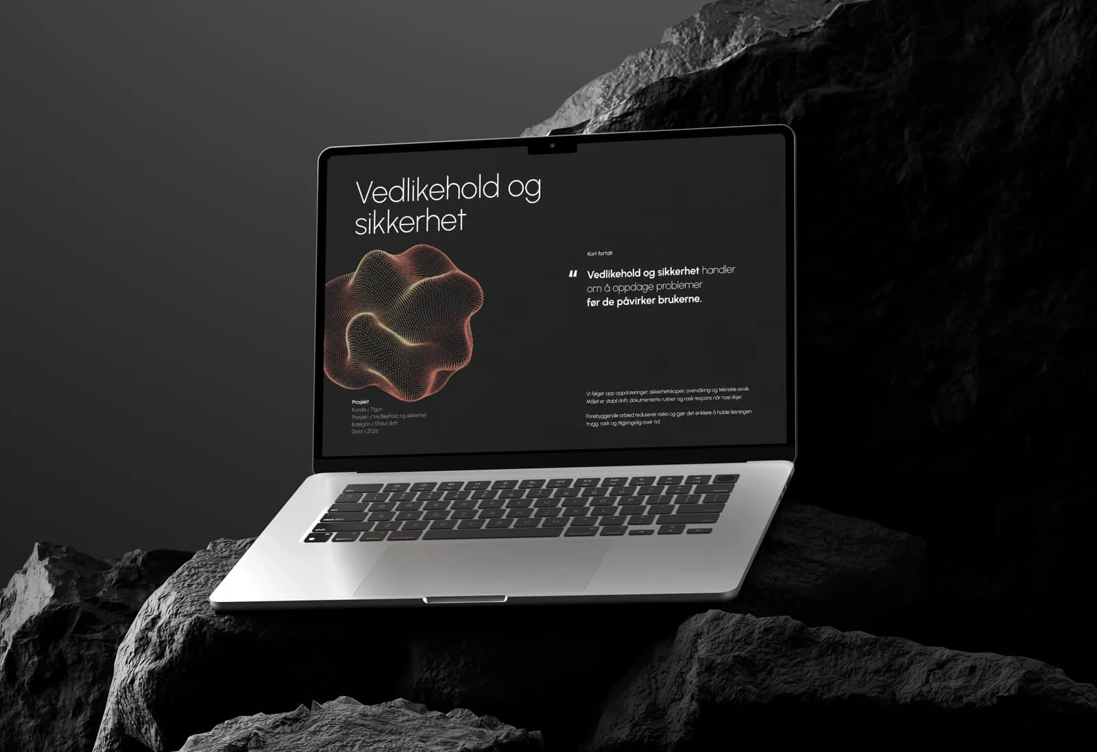 Laptop på stein med en oppsummering av hva vedlikehold og sikkerhet handler om