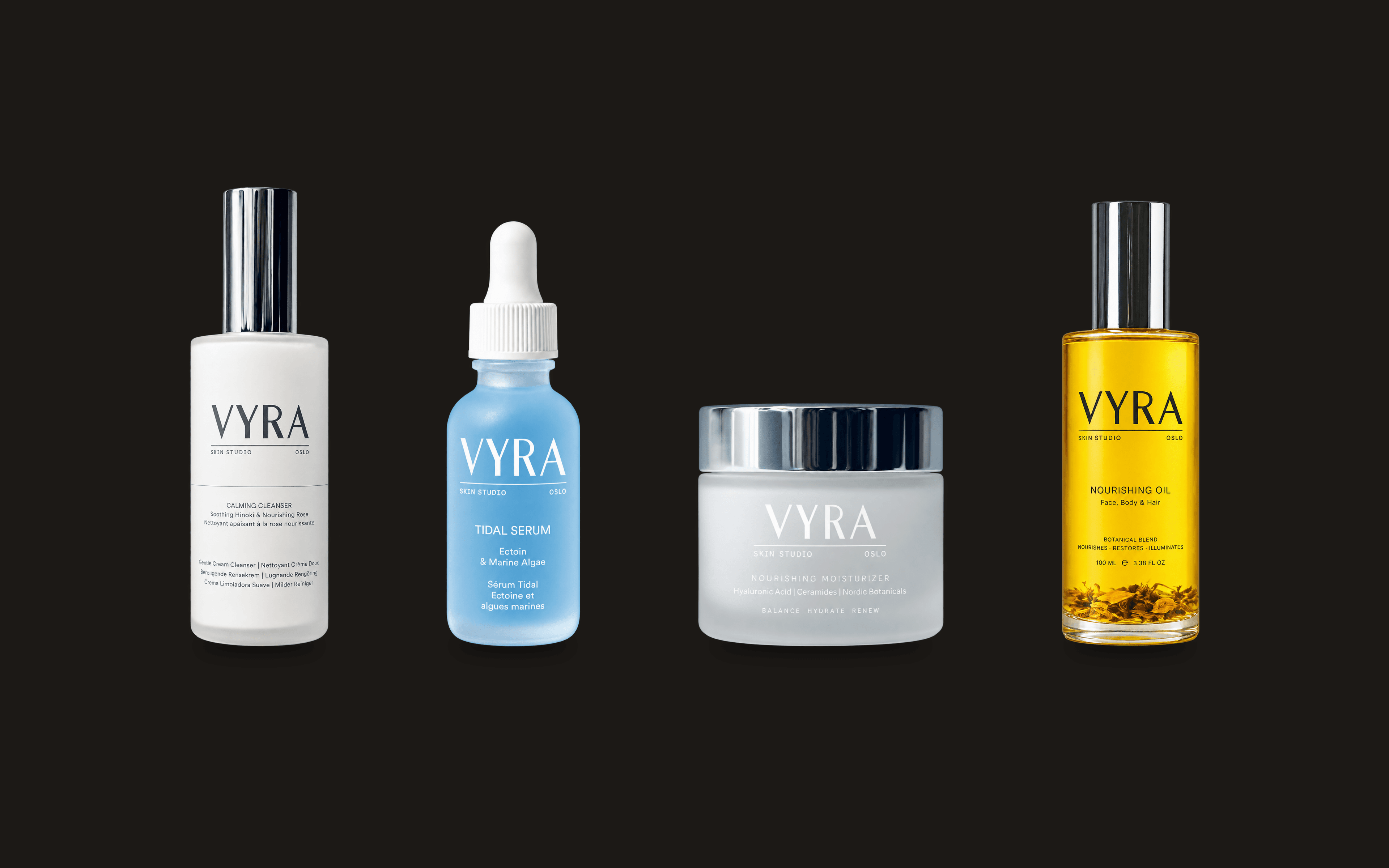 VYRAs fire produkter på rekke mot mørk bakgrunn: Calming Cleanser, Tidal Serum, Nourishing Moisturizer og Nourishing Oil
